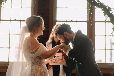 A newlywed couple celebrating together during their Indianapolis wedding ceremony at Tinker House Events.