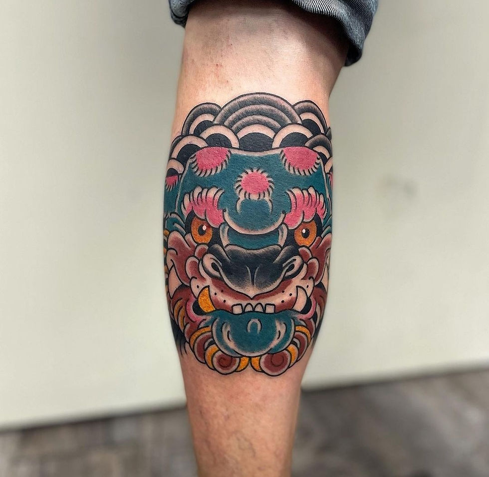 Foo dog tattoo in color american traditional by Mike Russell at Tattoolicious Honolulu