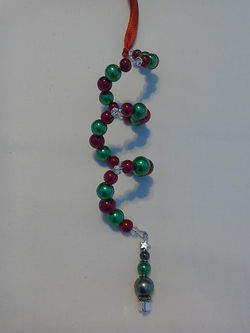 Red and green spiral with Christmas tree charm