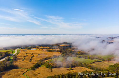 Aerial drone photography showing low clouds and fog in northeast Iowa in the fall. 