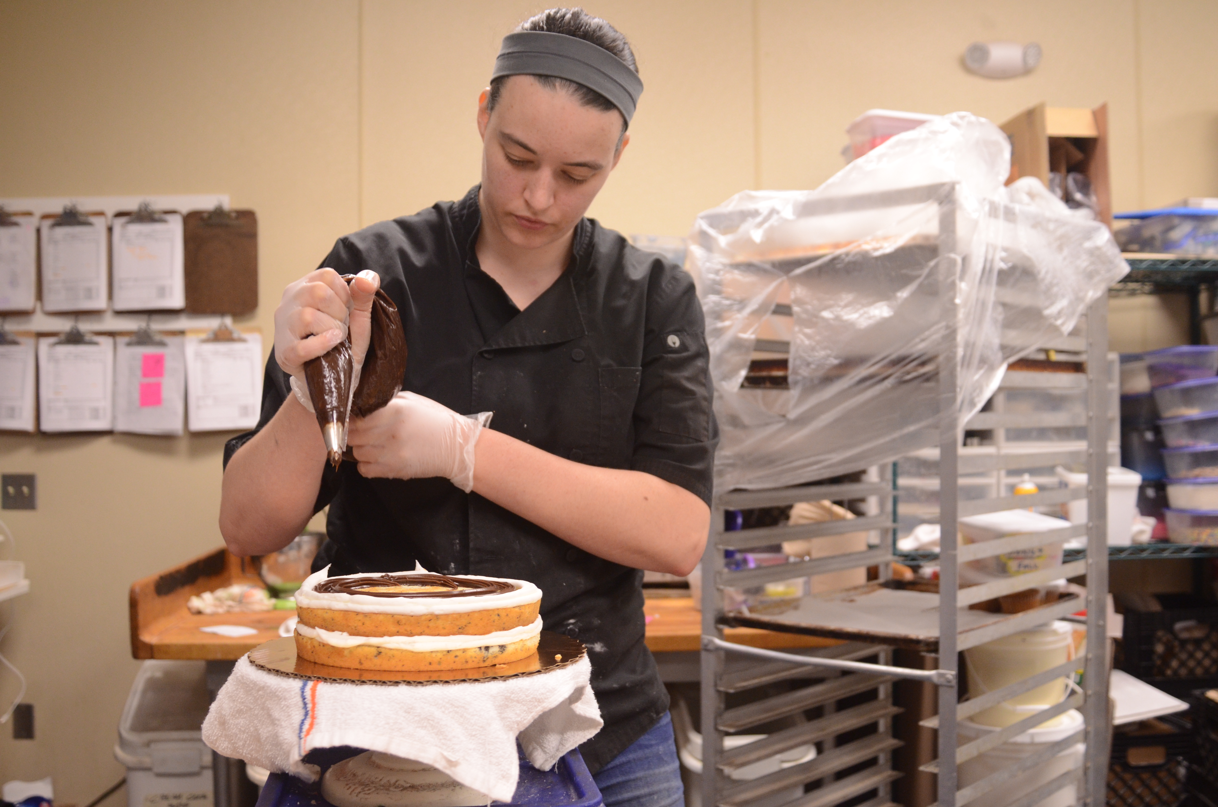 Haley Chapman begins icing the cake