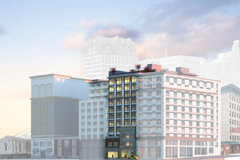 Northwest perspective rendering showing the mid rise massing stepping behind the heritage façades within the downtown skyline.