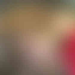 Hands holding dirty chanterelle mushrooms