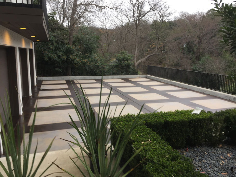 Custom stained concrete driveway by All Innovative Concrete Georgetown, TX.