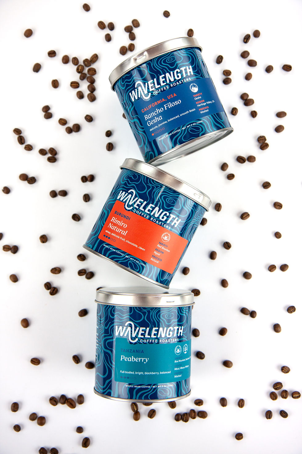 Wavelength cans of coffee on white background with coffee beans, cofee can/packaging design by awen&co