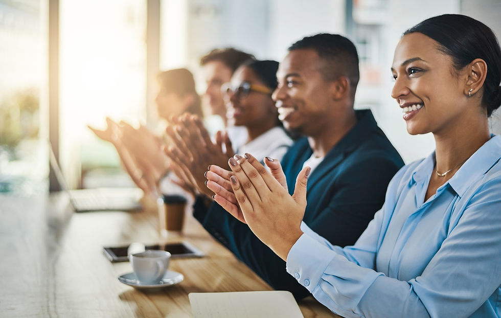 wellthat-was-great-cropped-shot-group-young-businesspeople-applauding-while-sitting-confer