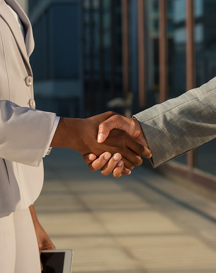 black-businesswoman-shaking-hands-with-male-partner.jpg