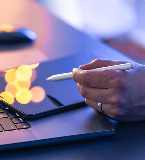 close-up-business-hand-with-stylus-pen-working-digital-tablet-laptop.jpg