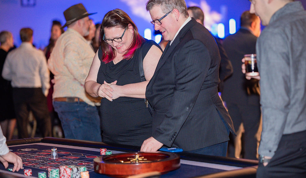 Couple playing roulette at an Ottawa casino party rental event by Full House Casino Rentals