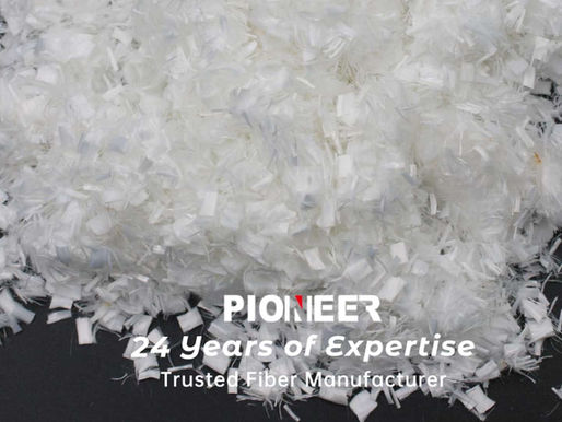 A heap of Pioneer Fibre's HPM PET polyester microfibers on a black background with text displaying "PIONEER 24 Years of Expertise Trusted Fiber Manufacturer.