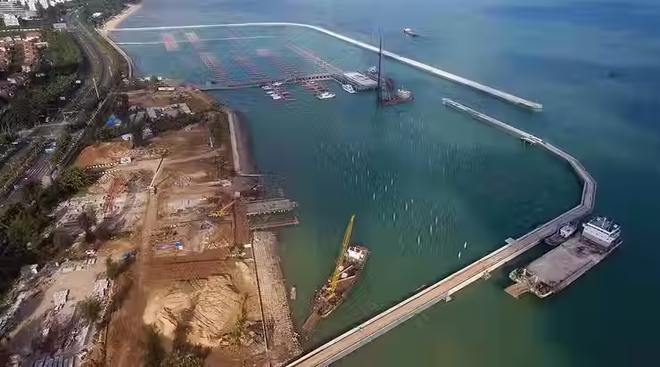 Aerial view of a marine port featuring floating docks and offshore platforms, showcasing the use of fiberglass in coastal infrastructure for superior corrosion resistance and durability under constant saltwater exposure.