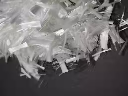 Close-up of PIONEER® HPM® UF PP ultra-fine polypropylene fibers for high-performance concrete reinforcement