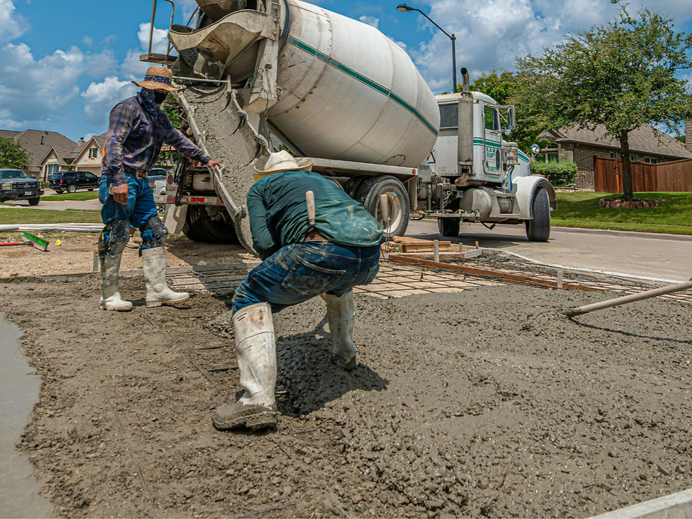 Workers pouring concrete over traditional steel mesh reinforcement during concrete floor construction before replacing wire mesh with Rimix 3D macro synthetic fiber.