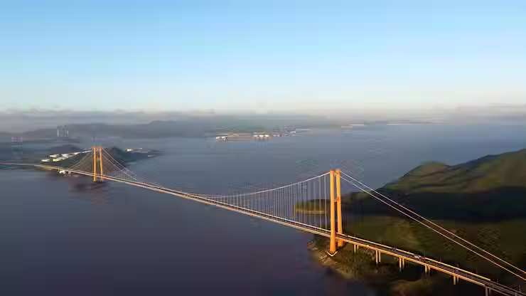 Aerial view of long-span suspension bridge, showcasing structural integrity from advanced fiber-reinforced concrete with optimized microstructure