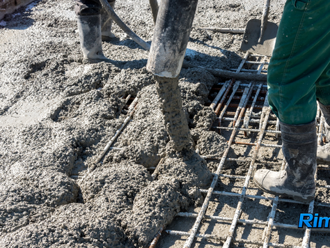 Pouring concrete reinforced with Rimix3D macro synthetic fibers for ASTM C1609 flexural performance testing validation.