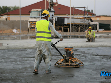 Power trowel finishing on concrete slab featuring Rimix3D fiber reinforcement system.