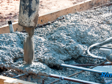 Pumping wet fiber reinforced concrete mixed with Rimix 3D polyolefin synthetic fibers into slab formwork.