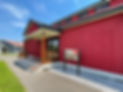 An image of the Discovery Center, a large red building.