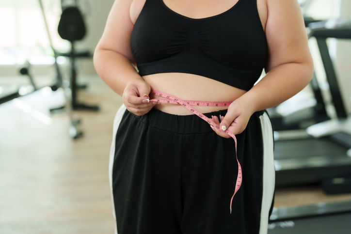 woman measuring waist weight measuring tape