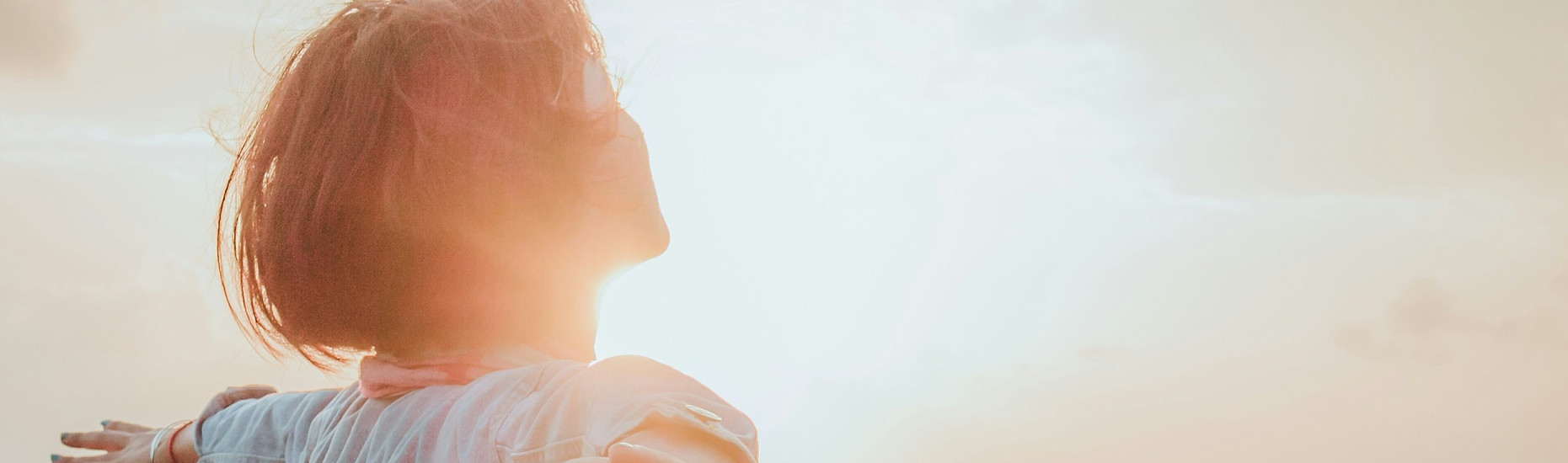 menopause support hypnotherapy Gloucester woman in sunshine