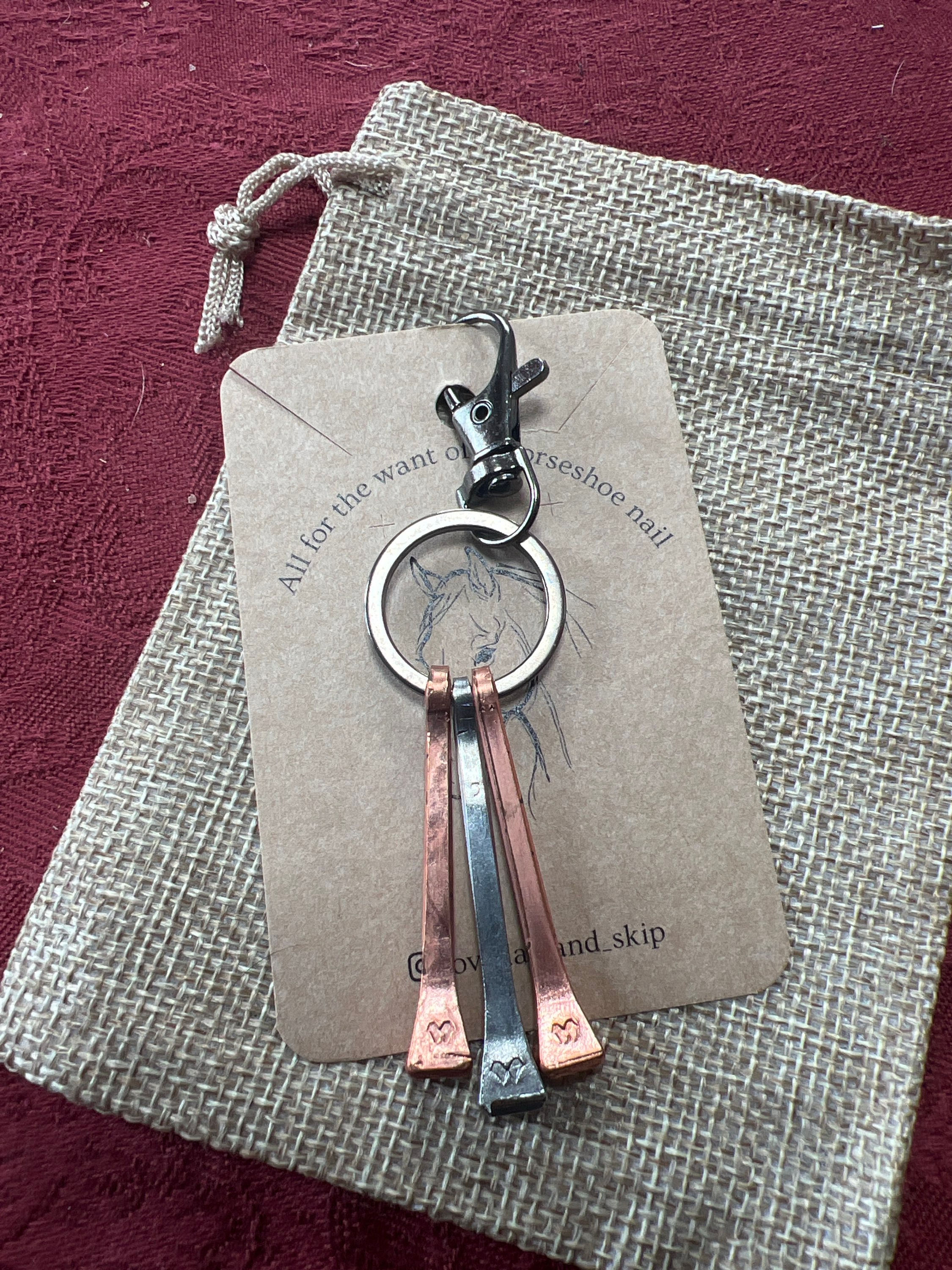 Copper and silver horseshoe nail keyring