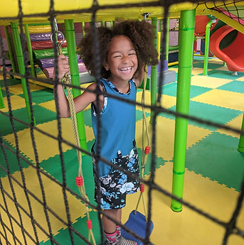 Happy girl on swing