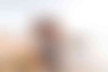 Father and daughter as they enjoy a sunset moment by the water