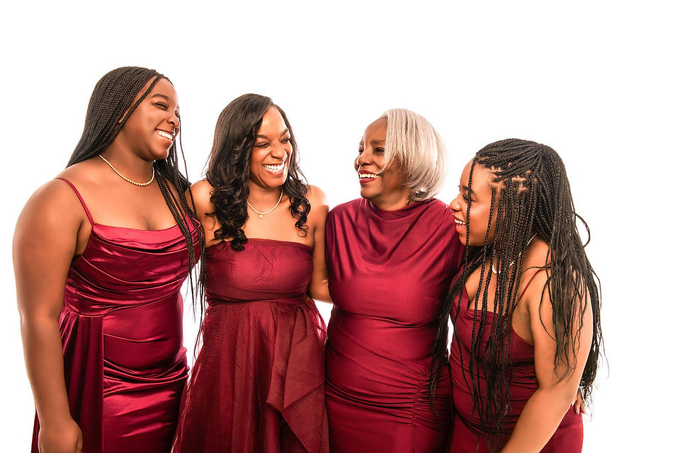 Elegant family glamour portraits with controlled studio lighting, highlighting textures and rich colors of the dresses