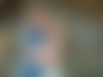 Husband and Wife smiling at sunset cliffs photoshoot