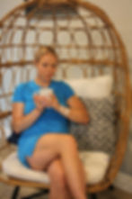 Relaxed, female client getting in-home IV therapy treatment Miami Florida