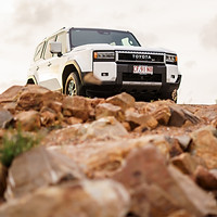 Professional image of a 4WD on rocky ground, taken for a custom branding shoot