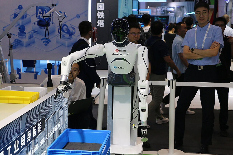 Industrial robot with engineers at the 2025 World Artificial Intelligence Conference in Shanghai