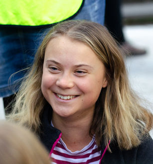 Greta Thunberg speaking at a public event. Source: Wikimedia Commons, Greta Thunberg in 2022.jpg. License/creator details: https://commons.wikimedia.org/wiki/File:Greta%20Thunberg%20in%202022.jpg