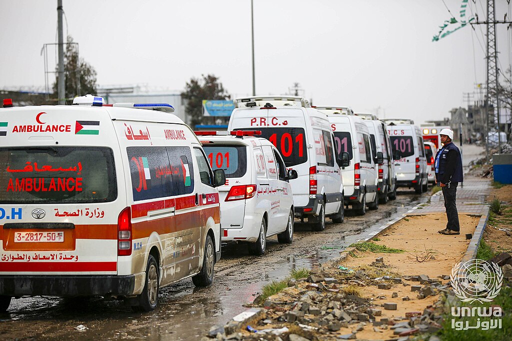 Palestinian Red Crescent ambulances queue near the Rafah crossing during a medical evacuation in Mar