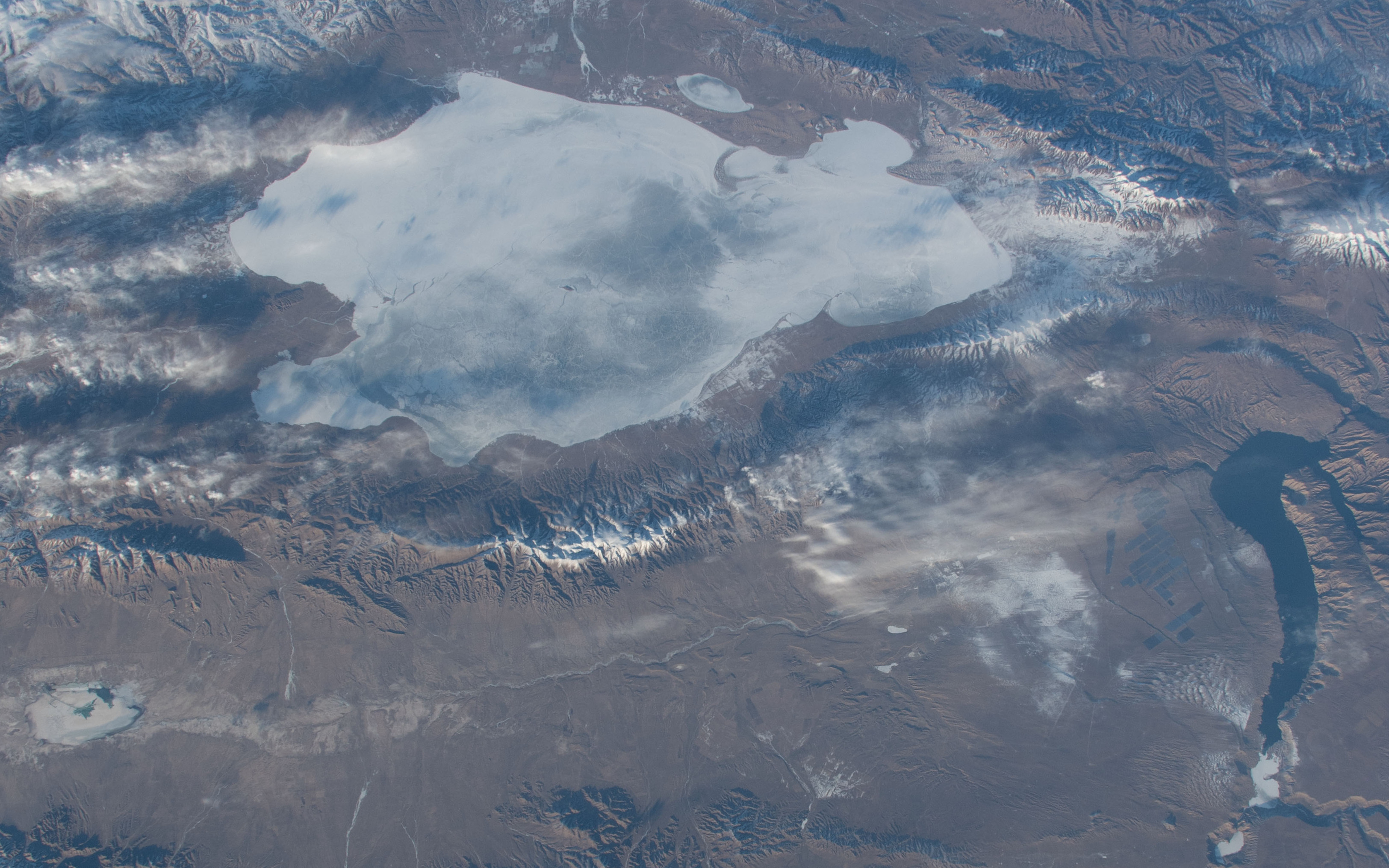 NASA astronaut photograph showing the Qinghai Lake and Longyangxia area with solar installations in northwestern China in January 2020; not the 2026 Gonghe complex