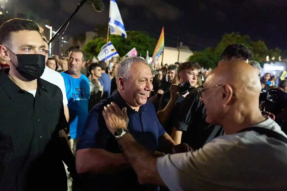 Gadi Eisenkot greets supporters at an anti-government rally in Tel Aviv on October 24, 2026