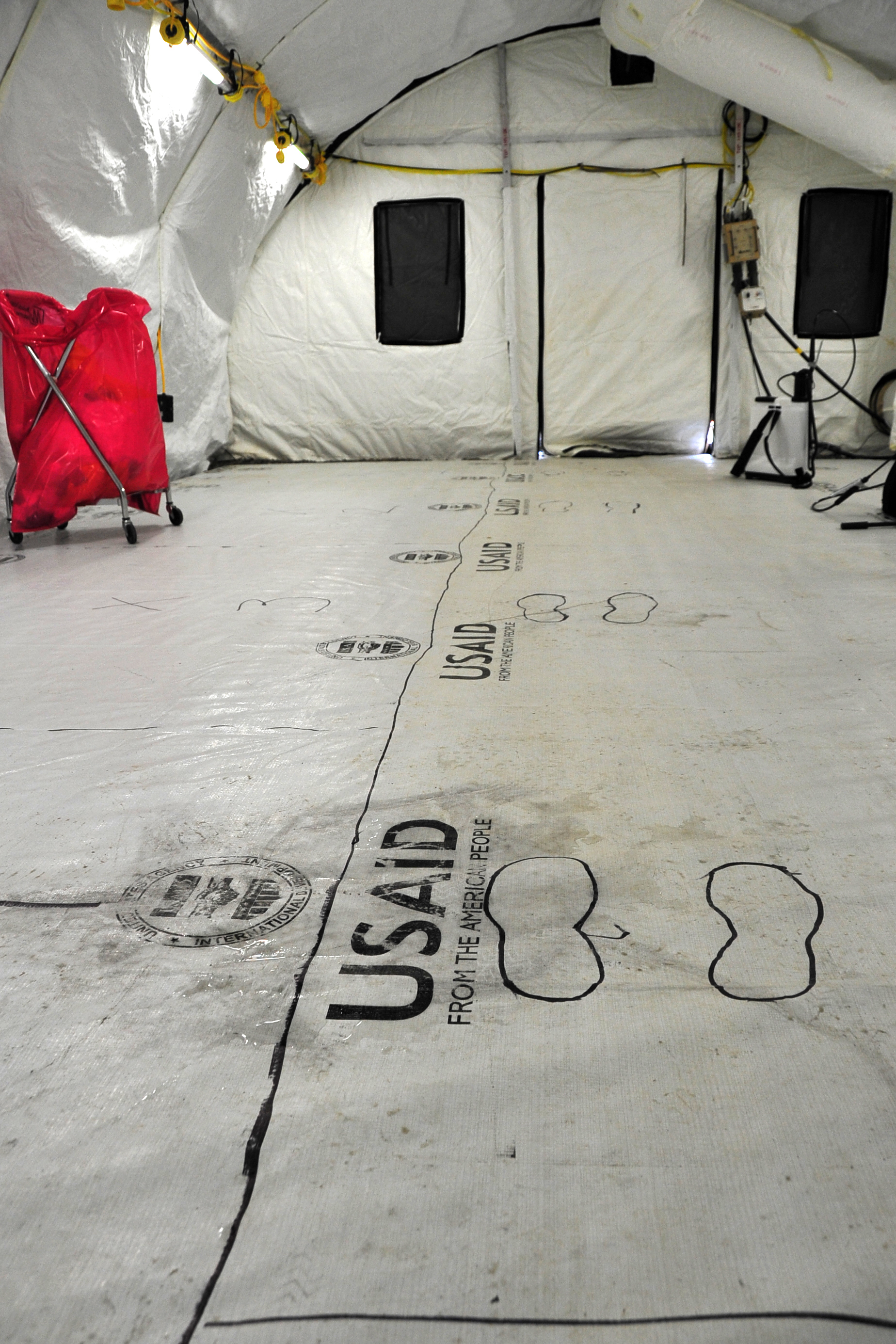 Archival photograph of the doffing station at a medical-worker Ebola treatment u