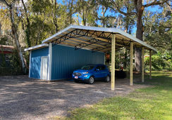 20x30x10 Open-Air Steel Truss Pole Barn with 10x30x10 Fully Enclosed Lean-To in Brooksville, FL | Equipment Storage by Patriot Pole Barns