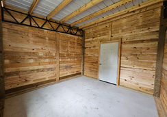 Horse barn with 4 stalls, wash rack, and enclosed tack room built in Bushnell, FL by Patriot Pole Barns, used as a multipurpose horse barn