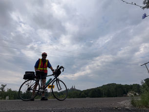 Ken Webster with his bicycle during his final training ride before departing for Lake Michigan.