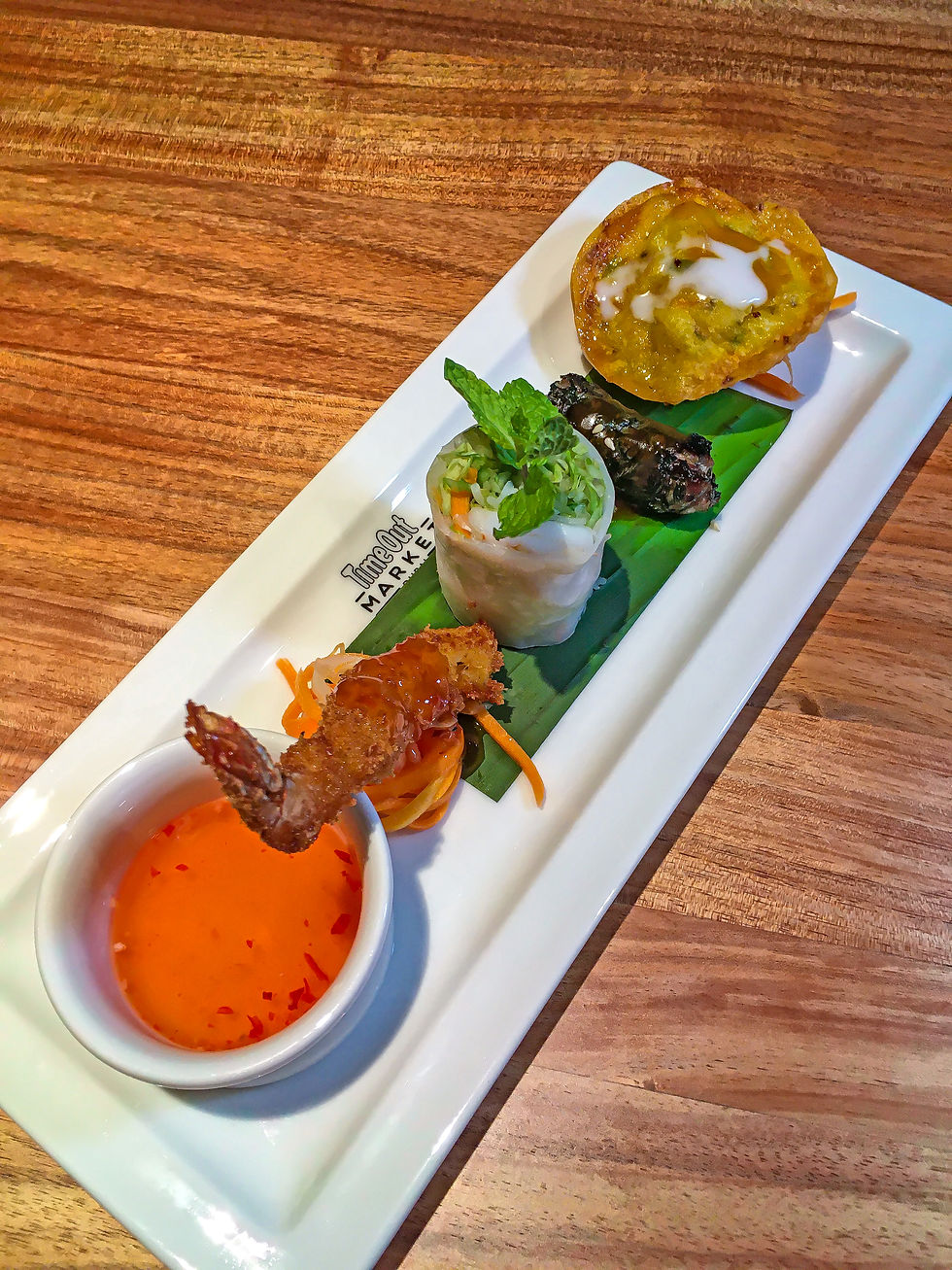 Viet Appetizer Platter with the Prawn Summer Roll, Duck Grilled Roll, Seafood Ravioli and Coconut Prawn Tempura.