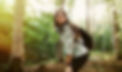 Young woman resting after a walk in the forest, carrying a backpack in the forest on sunse