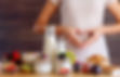 Female make shape of heart with her hands. Light summer breakfast with organic yogurts, fr