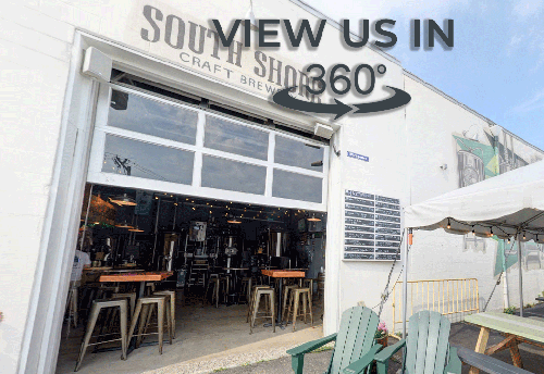 Outside area of the brewery showing tables and garage door opening to the brewery