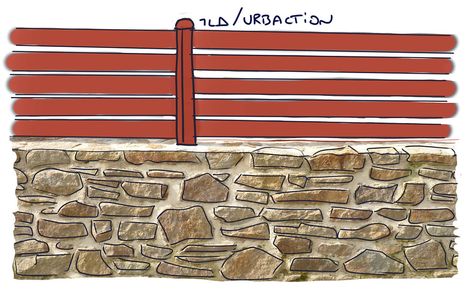 Mur bahut en pierre lisse couleur rouge.
