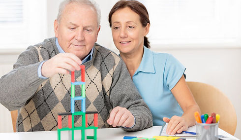 Woman helping Senior Man with Dementia engage his senses