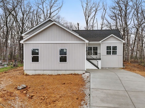 Newly built light gray house, 31998 Fairway Dr North