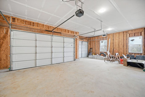 Spacious three-car garage with two doors
