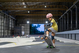 A small girl skateboarding