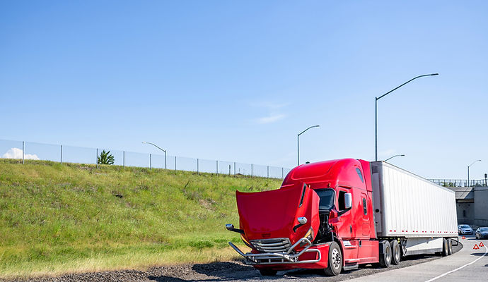 Red broken big rig semi truck with open hood standing on the road shoulder out of service
